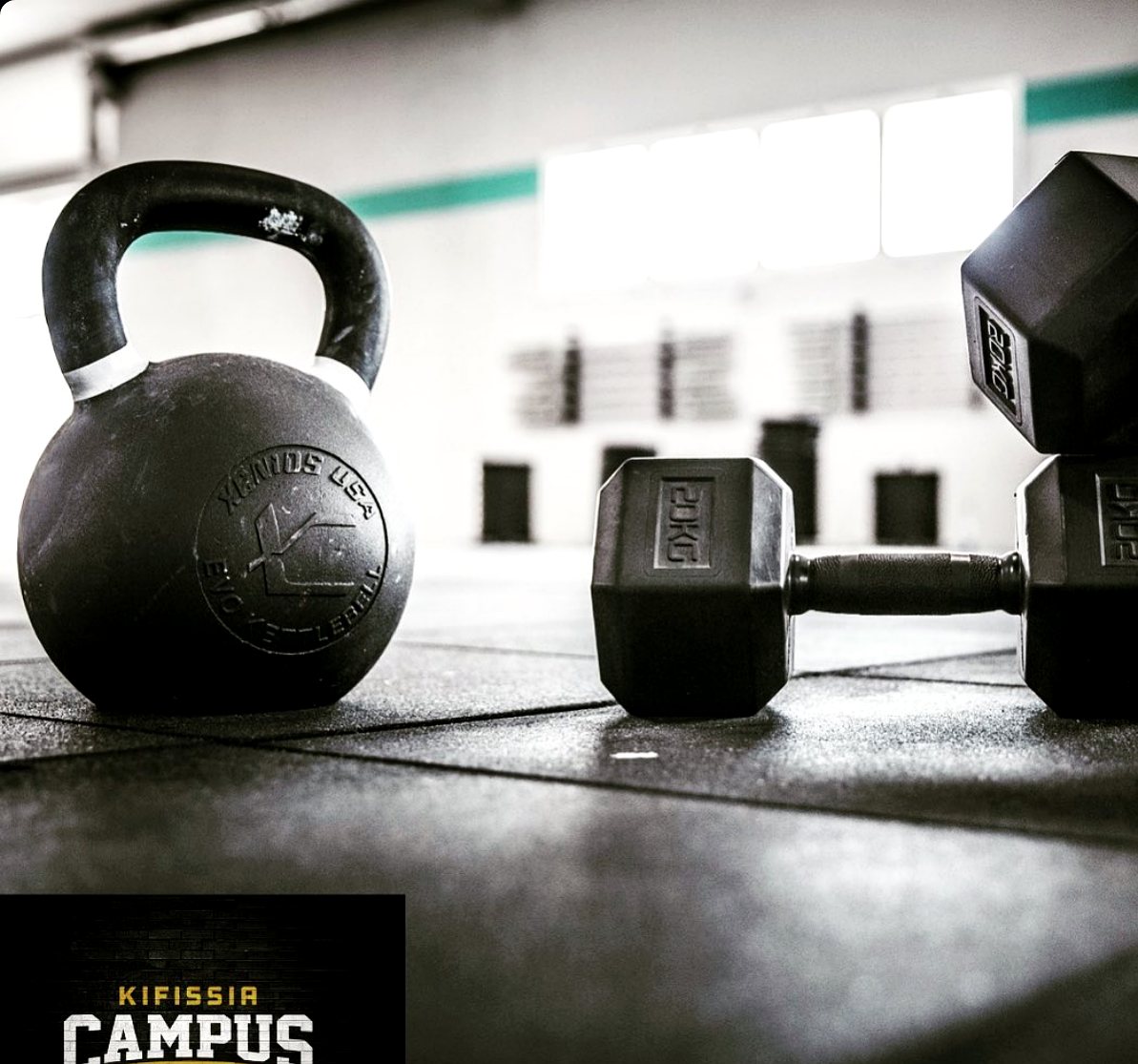 Kettlebell and dumbbells on the gym floor at Campus Kifissia